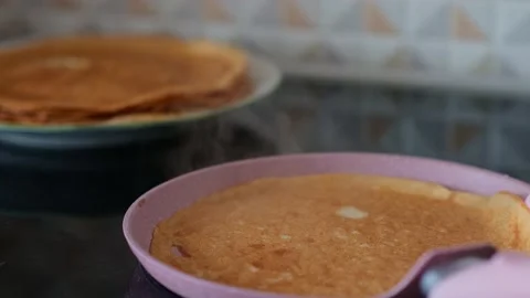 Flipping crepe on the fry pan using spatula. Stock Footage 273531382