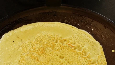 Flipping a crepe with a spatula Stock Footage 78507573
