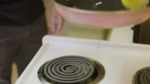 Flipping eggs in a pan Stock Footage 281657162