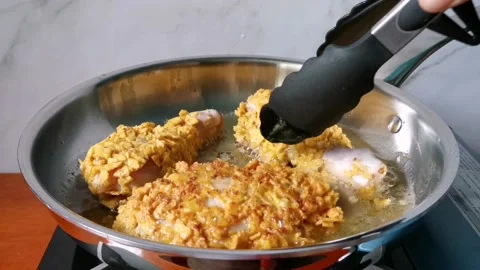 Flipping Fried Chicken Legs Stock Footage 161006134