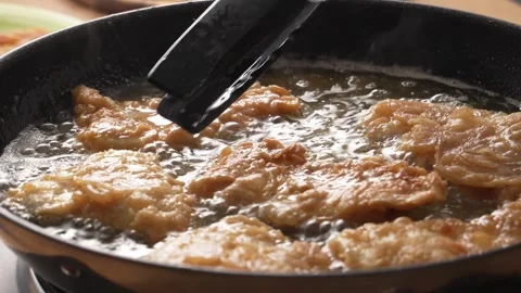 Flipping Fried Fish in Pan. Stock Footage 258571664