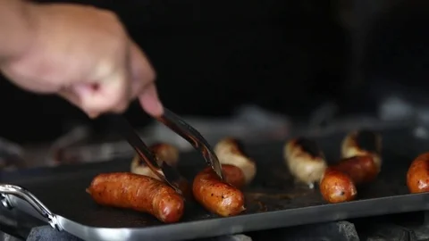 Flipping frying sausages Stockbeeldmateriaal 80886188