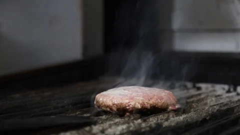 Flipping a Hamburger on the Grill 스톡 동영상 88977625