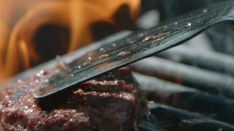 Flipping a Hamburger Patty Stock Footage 97292581