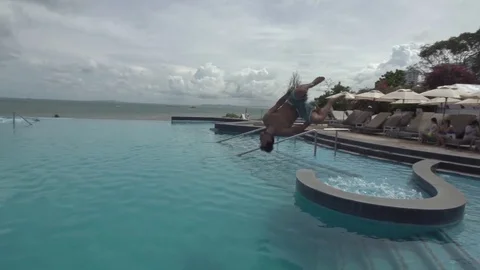 Flipping into Infinity Pool Slow Motion Stock Footage 78760060