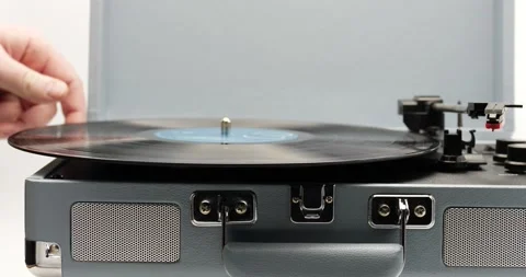 Flipping music record by hand close up spinning Stock Footage 150250973