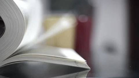 Flipping pages of a book Stock Footage 105421606