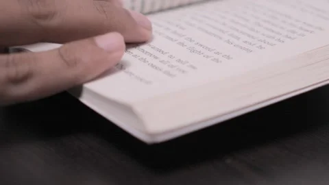 Flipping the Pages of a Novel. Stock Footage 342243810