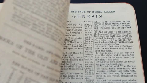 Flipping pages of an old bible. Genesis,... | Stock Video | Pond5