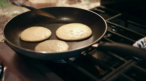 Flipping pancakes in pan Stock Footage 35693954