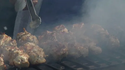 Flipping Skewers on the BBQ 스톡 동영상 99307187
