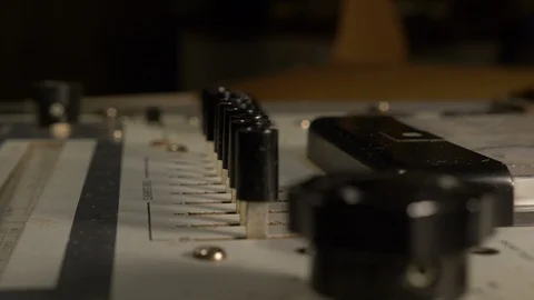 Flipping switches on a vintage electronic device Stock Footage 93543378