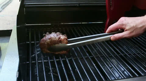 Flipping Tenderloins Stock Footage 22578213