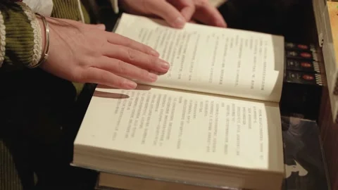 Flipping through the book action flipping the book learning to read Stock Footage 230064461