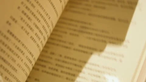 Flipping through the book action flipping the book learning to read Stock Footage 230228846