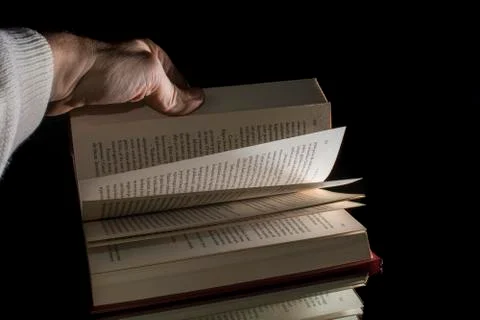 Flipping through a book Stock Photos