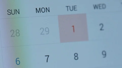 Flipping through calendar on tablet screen 4k Stock-Footage 70677625