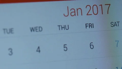 Flipping through calendar on tablet screen Video stock 70678458