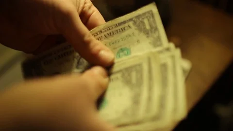 Flipping through dollar bills Stock Footage 72759120