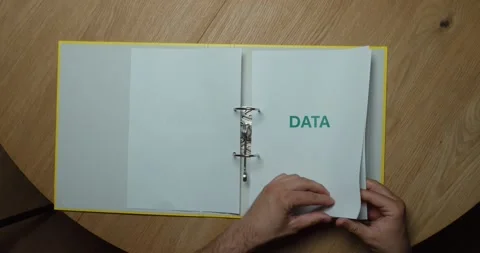 Flipping Through Folder with Data Pages Stock Footage 342344775