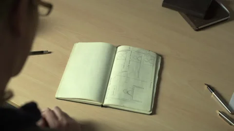 Flipping through notes then writing Stock Footage 68612558