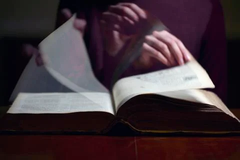Flipping Through An Old Book Stock Photos
