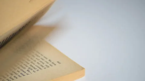 Flipping through pages of a book Stock Footage 67627700