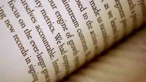 Flipping through pages of a book Stock Footage 139747858