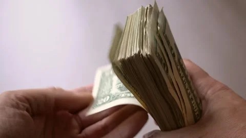 Flipping Through Stack Of American Cash Usa Dollars To Count Quickly Stock Footage 247418566
