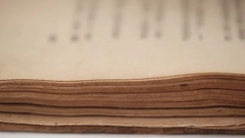 Flipping through yellowed pages old book closeup. concept of historical reading. Stock-Footage 252669361