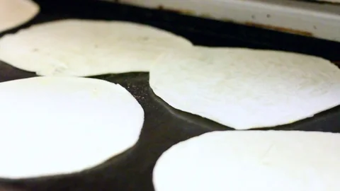 Flipping Tortillas in Restaurant Kitchen Stock Footage 79129356