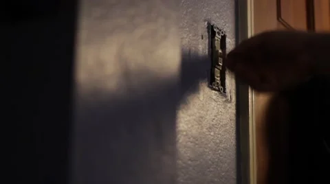 Flips light switch on and off Stock Footage 47528090