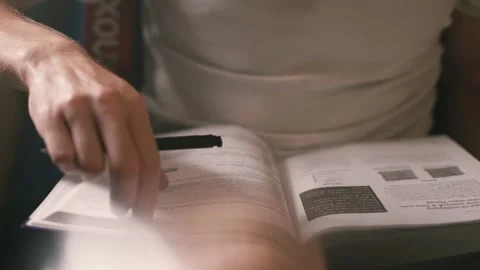 Flips a page of a book Stock Footage 140050608