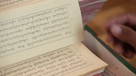 Flips through Buddhist texts Stock Footage 130222390