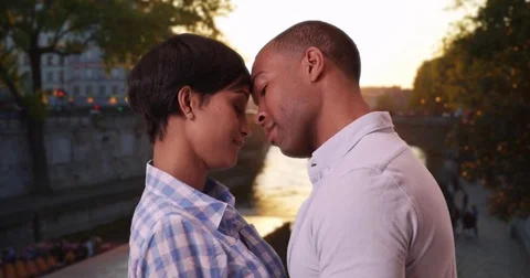 Flirtatious black couple sharing cute moment outside in Paris Stock Footage 84177489