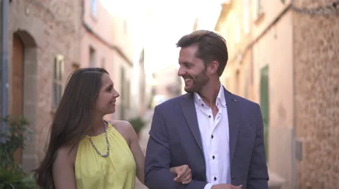 Flirting young couple walking Stock Footage 62699890