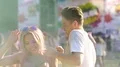 Flirty woman dancing with smiling handsome man at holi color festival, slow-mo HD Footage