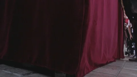 Float bearers raise a holy week pass . Low view of the feet jumping. Video stock 105734252