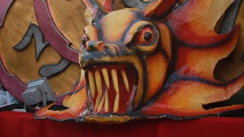 A float decorated with the face of a devil during a folk parade in Panama Stock Footage 86767318