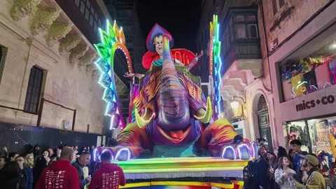 Float depicting a juggler riding a huge colorful circus elephant at the Malta Stock Footage 304563860