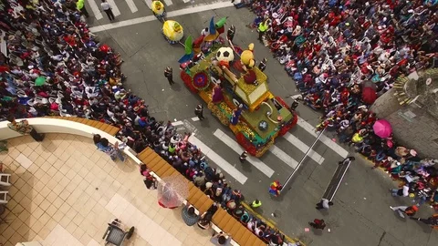 Float goes by as Crowd Watches during Carnival Parade in Ambato Stock Footage 73039758
