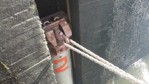 Float of Mechanism Of Mooring hook During Sluicing Gate On The Dam Stock Footage 155615034