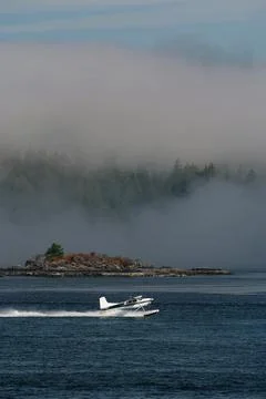 Float Plane Accelerates for Takeoff in Tofino on Vancouver Island in Canada Stock Photos