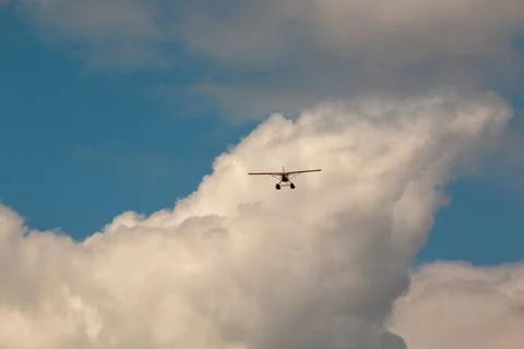 A float plane flying among the clouds Stock Photos