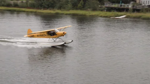 Float plane landing on the chena river at fairbanks, alaska Stock Footage 333218318