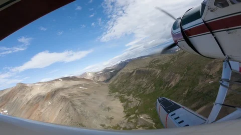 Float Plane Landing On Turquoise Alpine Lake On A Sunny Day Stock Footage 115058472