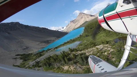 Float Plane Landing On Turquoise Alpine Lake On A Sunny Day Stock Footage 115060919
