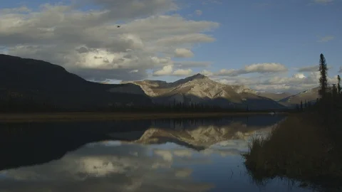 Float Plane Lands in River Across Reflection of Arrigetch Peaks Stock Footage 121640318
