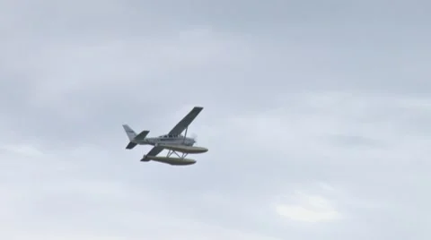 Float plane in Overcast Sky Stock Footage 7755859