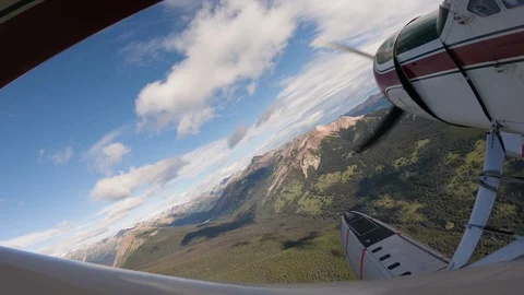 Float Plane POV Flying Over Mountains And Forest On A Sunny Day 스톡 동영상 115055309